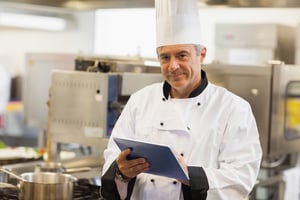 Professional chef focused during restaurant service