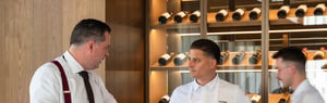 Hospitality professionals discussing restaurant operations