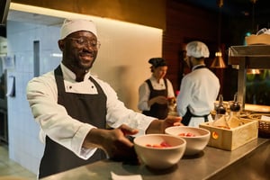 Chef serving dishes during restaurant service
